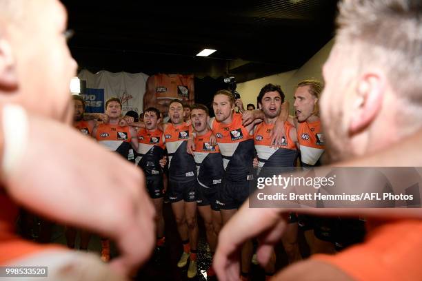 Giants players celebrate victory during the round 17 AFL match between the Greater Western Sydney Giants and the Richmond Tigers at Spotless Stadium...