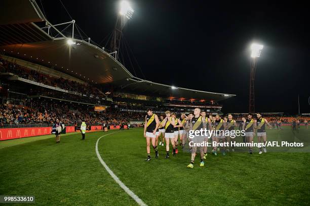 Tigers players show their dejection after defeat during the round 17 AFL match between the Greater Western Sydney Giants and the Richmond Tigers at...