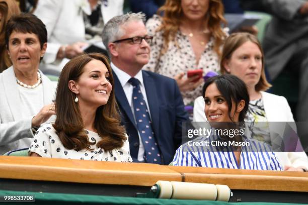 Catherine, Duchess of Cambridge and Meghan, Duchess of Sussex attend day twelve of the Wimbledon Lawn Tennis Championships at All England Lawn Tennis...