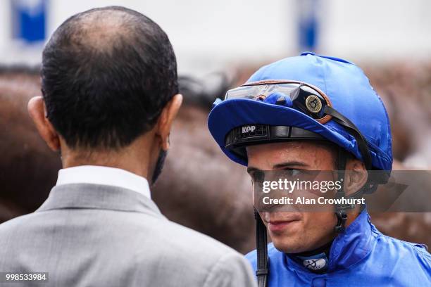 Jockey William Buick chats with Sheikh Mohammed bin Rashid Al Maktoum at Newmarket Racecourse on July 14, 2018 in Newmarket, United Kingdom.