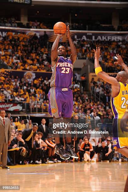 Jason Richardson of the Phoenix Suns shoots against Kobe Bryant of the Los Angeles Lakers in Game One of the Western Conference Finals during the...