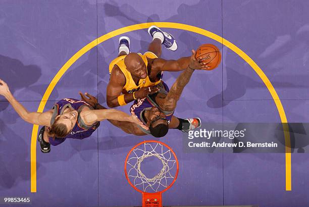 Lamar Odom of the Los Angeles Lakers has his shot challenged by Louis Amundson and Amar'e Stoudemire of the Phoenix Suns in Game One of the Western...
