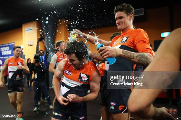 Brent Daniels and Rory Lobb of the Giants celebrate victory after the round 17 AFL match between the Greater Western Sydney Giants and the Richmond...