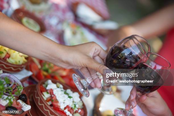 red wine toast - glass half full party stock pictures, royalty-free photos & images