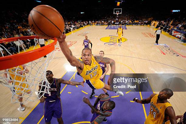 Guard Shannon Brown of the Los Angeles Lakers goes up for a dunk as guard Jason Richardson of the Phoenix Suns defends in Game One of the Western...