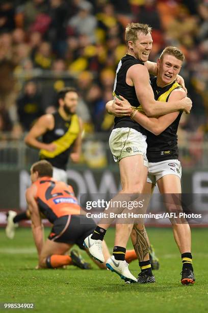 Jack Riewoldt of the Tigers celebrates kicking a goal with team mates during the round 17 AFL match between the Greater Western Sydney Giants and the...