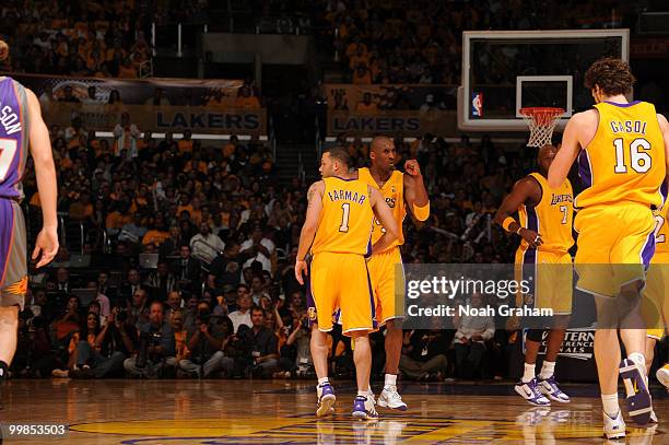 Jordan Farmar and Kobe Bryant of the Los Angeles Lakers come together against the Phoenix Suns in Game One of the Western Conference Finals during...