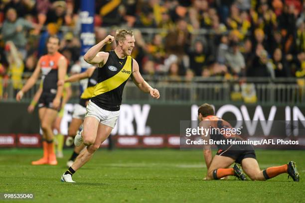 Jack Riewoldt of the Tigers celebrates kicking a goal with team mates during the round 17 AFL match between the Greater Western Sydney Giants and the...