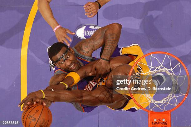 Amar'e Stoudemire of the Phoenix Suns has his shot challenged by Lamar Odom of the Los Angeles Lakers in Game One of the Western Conference Finals...