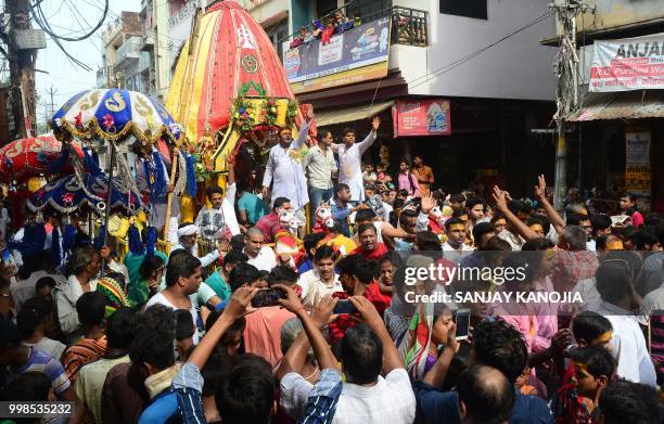 Indian devotees pull a chariot carrying the icon of Jagannath during the annual Hindu festival Rath Yatra or chariot procession in Allahabad on July...