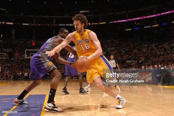 Pau Gasol of the Los Angeles Lakers drives past Amar'e Stoudemire of the Phoenix Suns in Game One of the Western Conference Finals during the 2010...