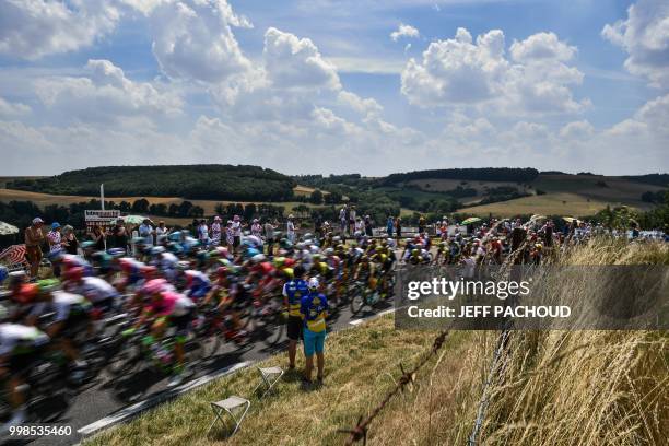 The pack chases a two-men breakaway near Les Andelys during the eighth stage of the 105th edition of the Tour de France cycling race between Dreux...