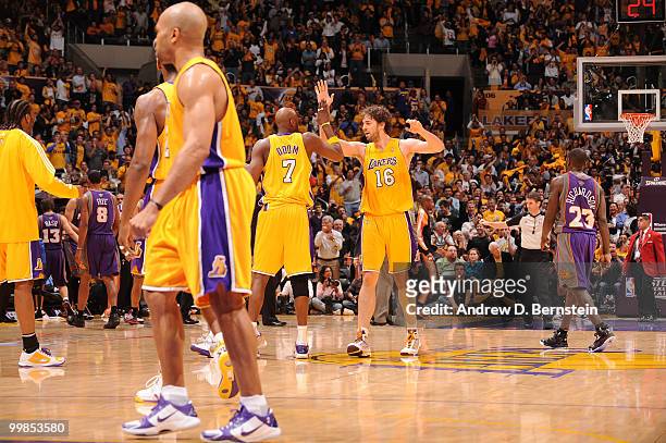Lamar Odom and Pau Gasol of the Los Angeles Lakers slap hands during a game against the Phoenix Suns in Game One of the Western Conference Finals...