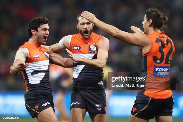 Tim Taranto, Sam Reid and Ryan Griffen of the Giants celebrate victory at fulltime during the round 17 AFL match between the Greater Western Sydney...