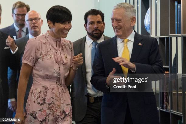 Secretary of Defence James Mattis and Norwegian Foreign Minister Ine Eriksen Soreide speak on their way to a press conference in Olso on July 14,...