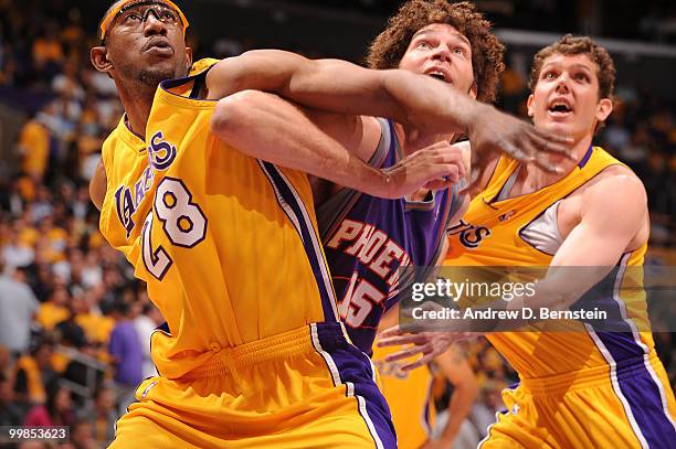 Robin Lopez of the Phoenix Suns battles for position against DJ Mbenga and Luke Walton of the Los Angeles Lakers in Game One of the Western...