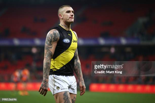 Dustin Martin of the Tigers looks dejected as he leaves the pitch during the round 17 AFL match between the Greater Western Sydney Giants and the...