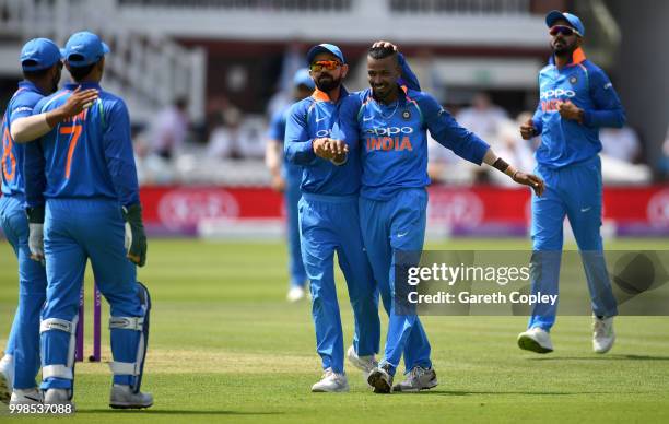 Hardik Pandya of India celebrates with Virat Kohli after dismissing Ben Stokes of England during the 2nd ODI Royal London One-Day match between...