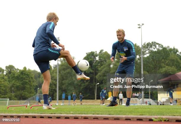 Per Skjelbred and Fabian Lustenberger of Hertha BSC during the training camp at Volkspark-Stadion on July 14, 2018 in Neuruppin, Germany.