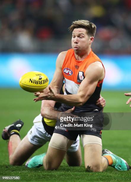 Toby Greene of the Giants controls the ball during the round 17 AFL match between the Greater Western Sydney Giants and the Richmond Tigers at...