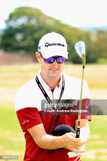 Justin Rose of England practices on the range with a training aid during day three of the Aberdeen Standard Investments Scottish Open at Gullane Golf...