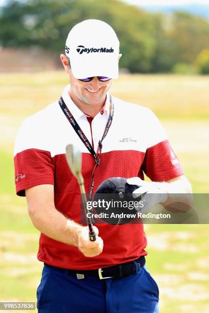 Justin Rose of England practices on the range with a training aid during day three of the Aberdeen Standard Investments Scottish Open at Gullane Golf...