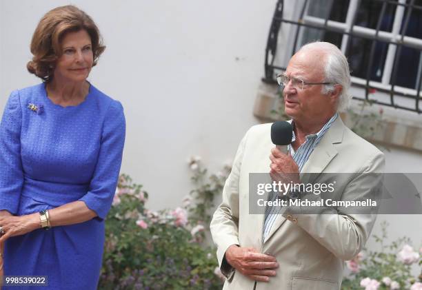 Queen Silvia of Sweden and King Carl Gustaf of Sweden speaks during the occasion of The Crown Princess Victoria of Sweden's 41st birthday...