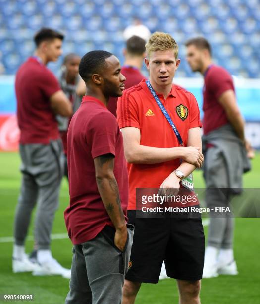 Raheem Sterling of England speaks to Kevin De Bruyne of Belgium during a pitch inspection prior to the 2018 FIFA World Cup Russia 3rd Place Playoff...