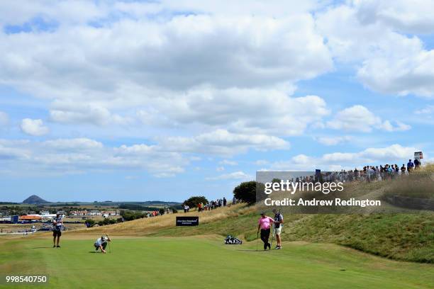 Danny Willett of England lines up a putt on hole one during day three of the Aberdeen Standard Investments Scottish Open at Gullane Golf Course on...