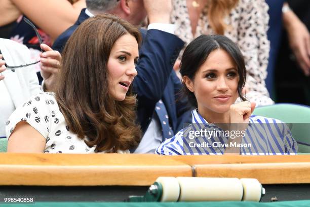 Catherine, Duchess of Cambridge and Meghan, Duchess of Sussex attend day twelve of the Wimbledon Lawn Tennis Championships at All England Lawn Tennis...