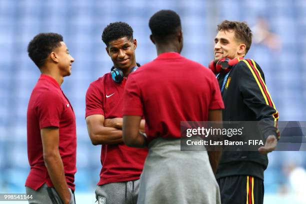 Adnan Januzaj of Belgium speaks with Jesse Lingard of England, Marcus Rashford of England, and Danny Welbeck of England during a pitch inspection...
