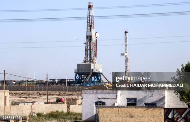 Picture taken on July 14, 2018 shows a view of the oil fields in al-Qurnah, some 100 kilometers north of Basra in southern Iraq. - Iraqi Prime...