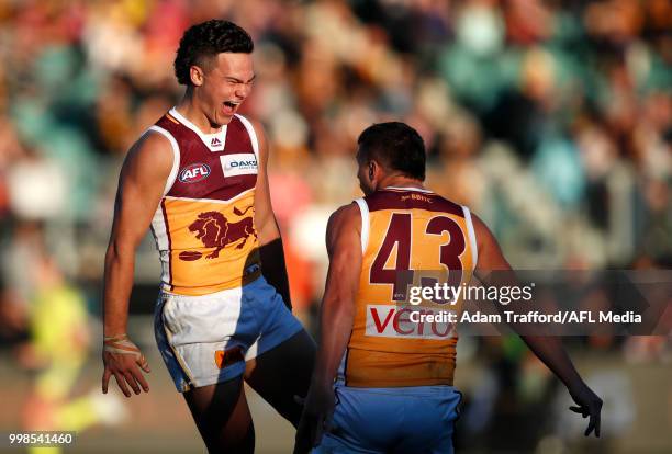 Cameron Rayner of the Lions celebrates a goal with Jake Barrett of the Lions during the 2018 AFL round 17 match between the Hawthorn Hawks and the...