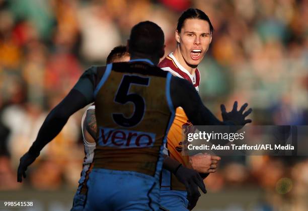 Eric Hipwood of the Lions celebrates a goal with Mitch Robinson of the Lions during the 2018 AFL round 17 match between the Hawthorn Hawks and the...