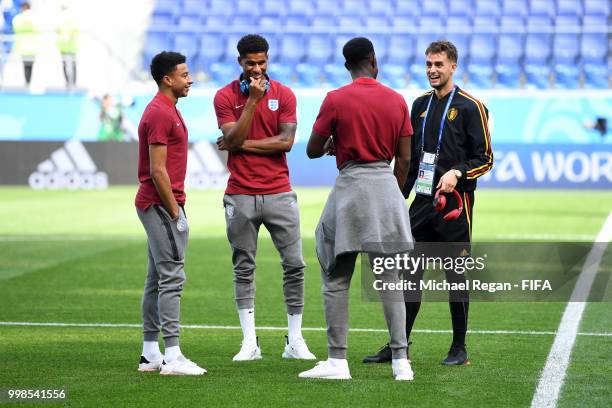 Adnan Januzaj of Belgium speaks with Jesse Lingard of England, Marcus Rashford of England, and Danny Welbeck of England during a pitch inspection...