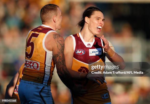 Eric Hipwood of the Lions celebrates a goal with Mitch Robinson of the Lions during the 2018 AFL round 17 match between the Hawthorn Hawks and the...