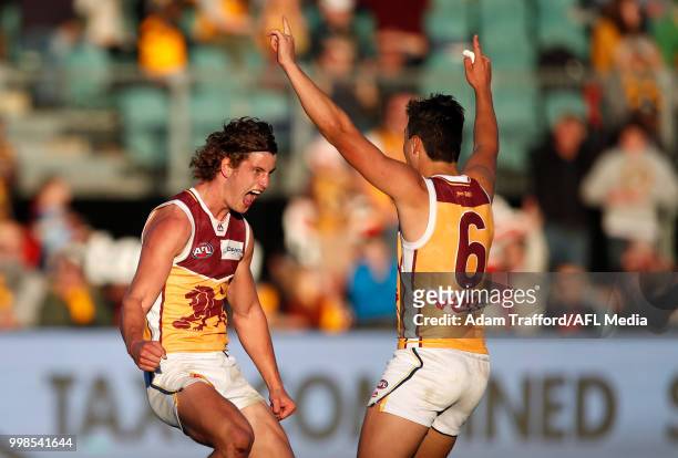 Jarrod Berry of the Lions celebrates a goal to seal the match with Hugh McCluggage of the Lions during the 2018 AFL round 17 match between the...