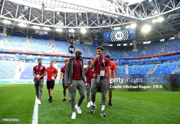 Fabian Delph and Dele Alli of England walk across the pitch during a pitch inspection prior to the 2018 FIFA World Cup Russia 3rd Place Playoff match...
