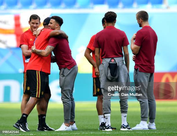 Vincent Kompany of Belgium greets Kyle Walker of England during a pitch inspection prior to the 2018 FIFA World Cup Russia 3rd Place Playoff match...