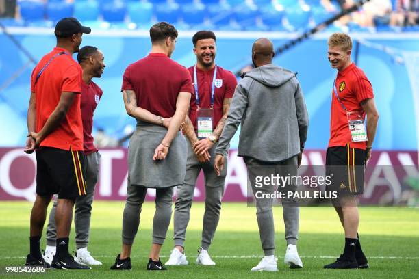 Belgium's defender Vincent Kompany, England's forward Raheem Sterling, England's defender John Stones, England's defender Kyle Walker, England's...