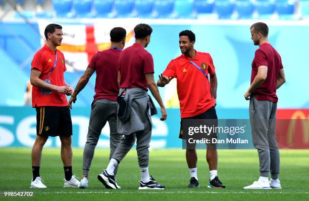 Mossua Dembele and Jan Vertonghen of Belgium talk to Eric Dier, Kyle Walker and Dele Alli of England during a pitch inspection prior to the 2018 FIFA...