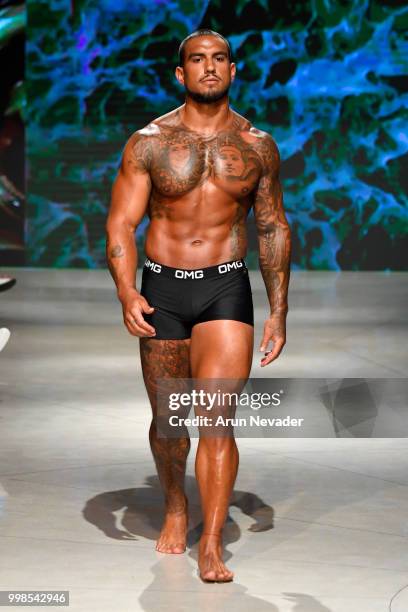 Model walks the runway for OMG Miami Swimwear at Miami Swim Week powered by Art Hearts Fashion Swim/Resort 2018/19 at Faena Forum on July 13, 2018 in...