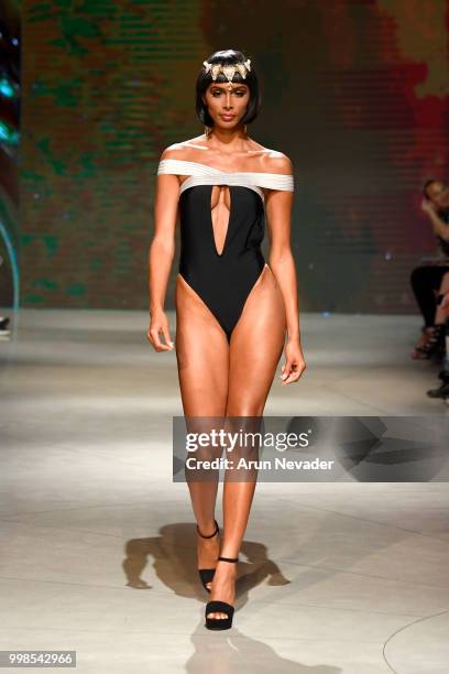 Model walks the runway for OMG Miami Swimwear at Miami Swim Week powered by Art Hearts Fashion Swim/Resort 2018/19 at Faena Forum on July 13, 2018 in...