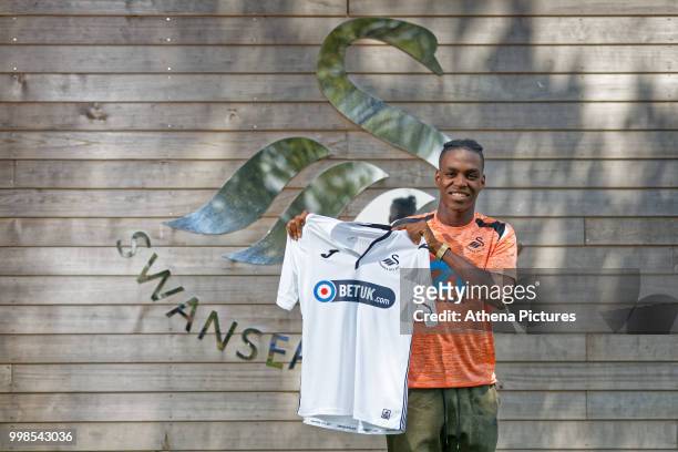 Joel Asoro holds a home shirt after Swansea City Unveil New Signing Joel Asoro at The Fairwood Training Ground on July 13, 2018 in Swansea, Wales.
