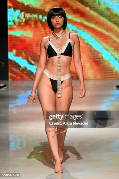 Model walks the runway for OMG Miami Swimwear at Miami Swim Week powered by Art Hearts Fashion Swim/Resort 2018/19 at Faena Forum on July 13, 2018 in...