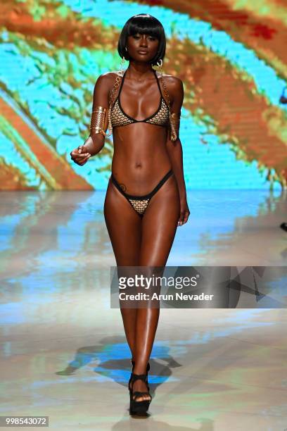 Model walks the runway for OMG Miami Swimwear at Miami Swim Week powered by Art Hearts Fashion Swim/Resort 2018/19 at Faena Forum on July 13, 2018 in...