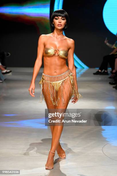 Model walks the runway for OMG Miami Swimwear at Miami Swim Week powered by Art Hearts Fashion Swim/Resort 2018/19 at Faena Forum on July 13, 2018 in...