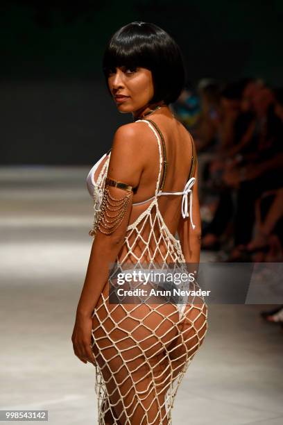 Model walks the runway for OMG Miami Swimwear at Miami Swim Week powered by Art Hearts Fashion Swim/Resort 2018/19 at Faena Forum on July 13, 2018 in...