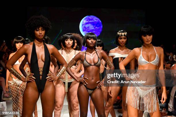 Models walk the runway for OMG Miami Swimwear at Miami Swim Week powered by Art Hearts Fashion Swim/Resort 2018/19 at Faena Forum on July 13, 2018 in...
