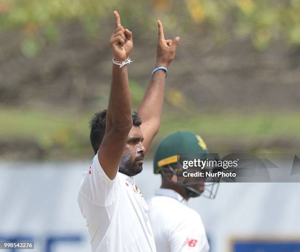 Sri Lankan cricketer Dilruwan Perera celebrates during the 3rd day's play in the first Test cricket match between Sri Lanka and South Africa at Galle...